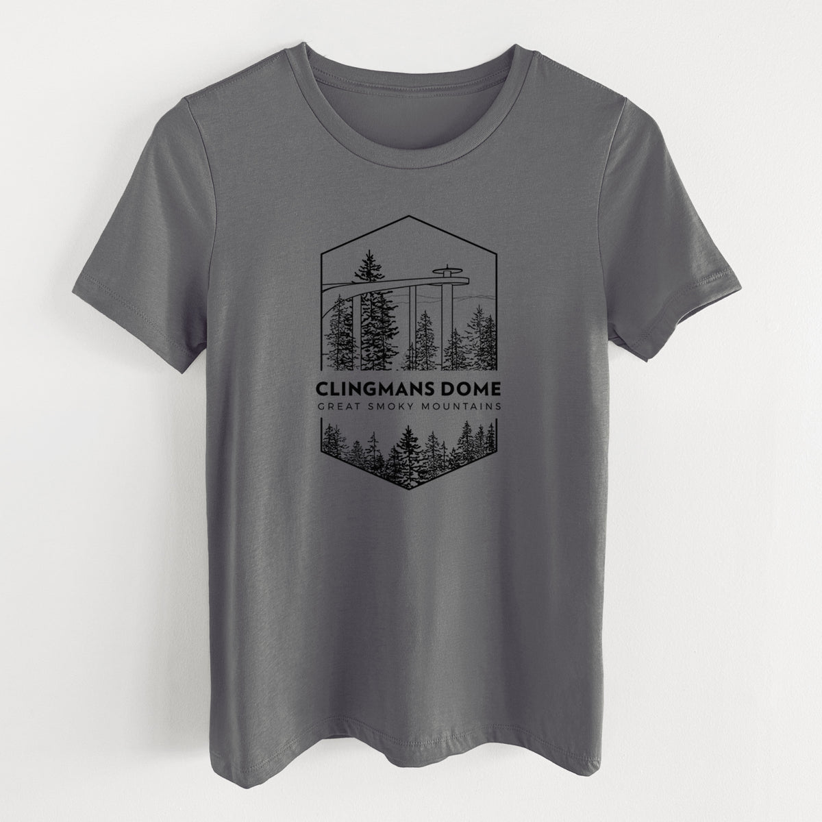 Asphalt women's relaxed fit cotton t-shirt laid flat, printed with a black line art badge of the Clingmans Dome observation tower above a pine forest, with the words Clingmans Dome, Great Smoky Mountains.