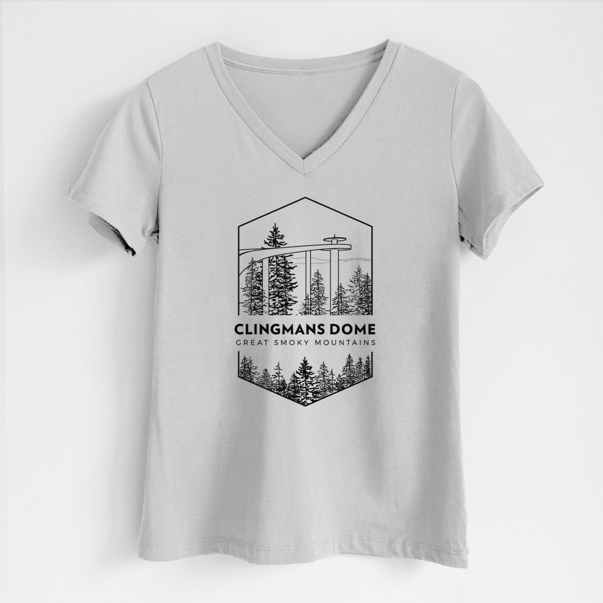 Lunar grey women's relaxed fit cotton V-neck t-shirt laid flat, printed with a black line art badge of the Clingmans Dome observation tower above a pine forest, with the words Clingmans Dome, Great Smoky Mountains.