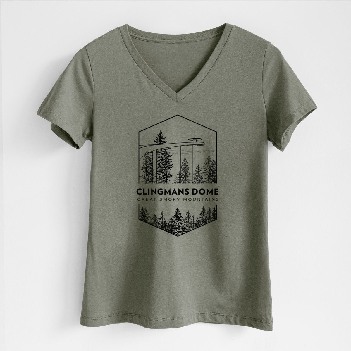 Military green women's relaxed fit cotton V-neck t-shirt laid flat, printed with a black line art badge of the Clingmans Dome observation tower above a pine forest, with the words Clingmans Dome, Great Smoky Mountains.