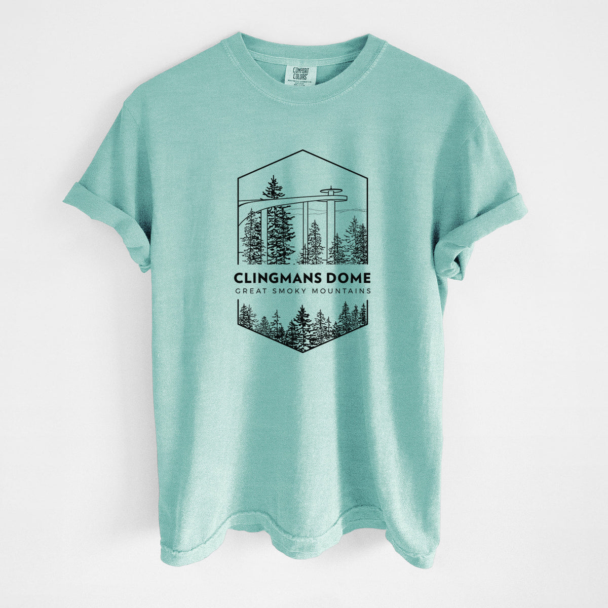 Chalky mint Comfort Colors t-shirt laid flat, printed with a black line art badge of the Clingmans Dome observation tower above a pine forest, with the words Clingmans Dome, Great Smoky Mountains.