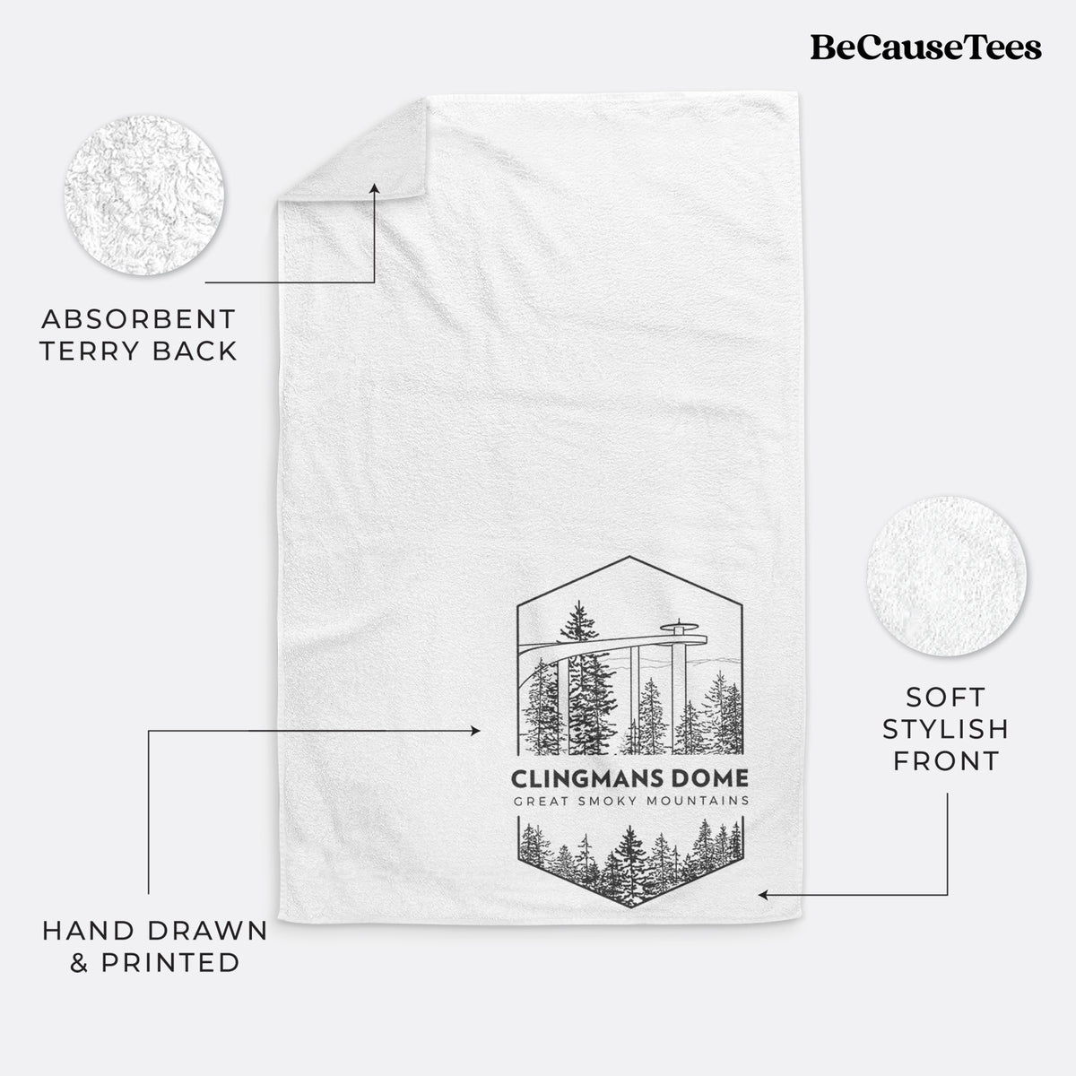 White hand towel printed with a black line art badge of the Clingmans Dome observation tower above a pine forest, with the words Clingmans Dome, Great Smoky Mountains.
