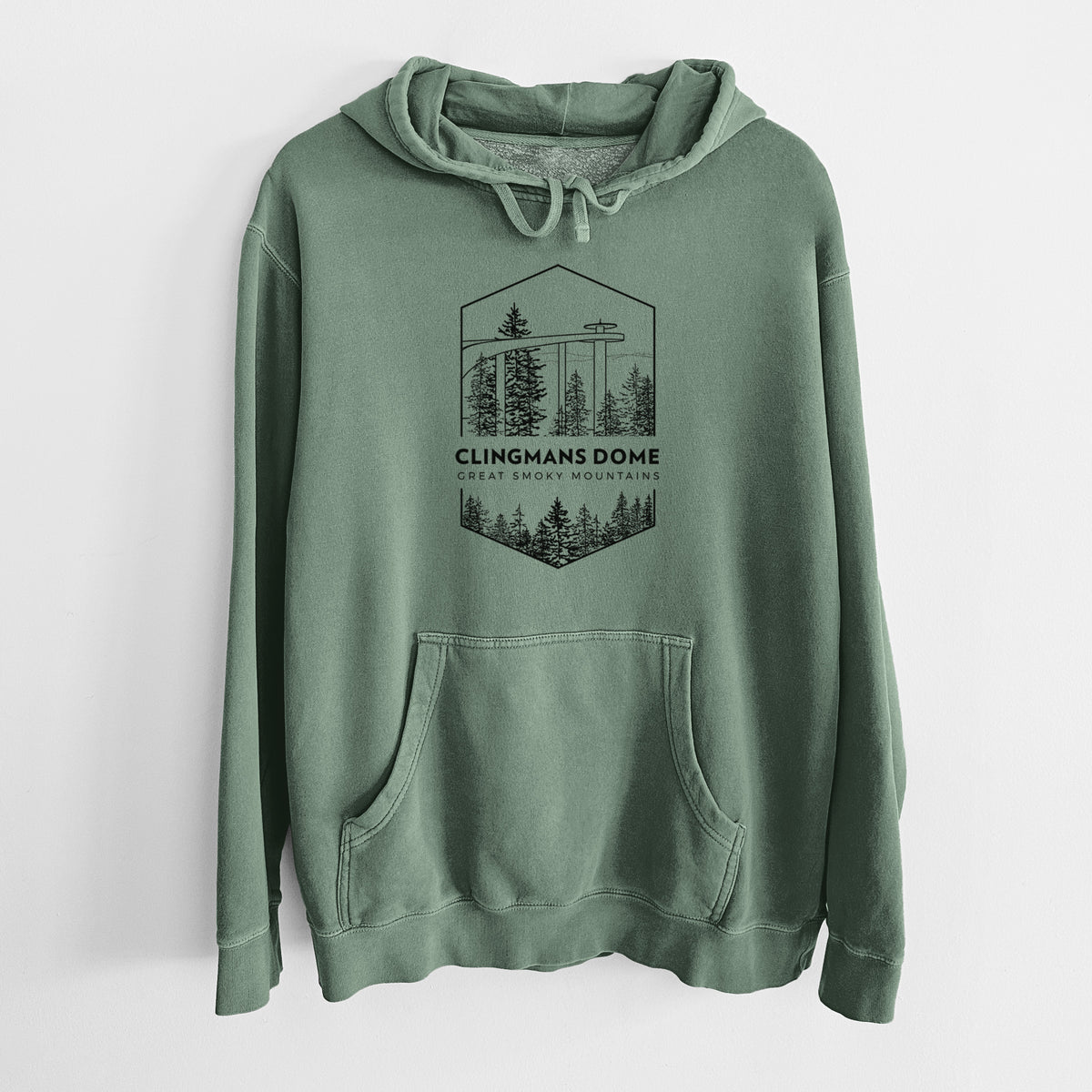 Alpine green pigment dyed hoodie laid flat, printed with a black line art badge of the Clingmans Dome observation tower above a pine forest, with the words Clingmans Dome, Great Smoky Mountains.