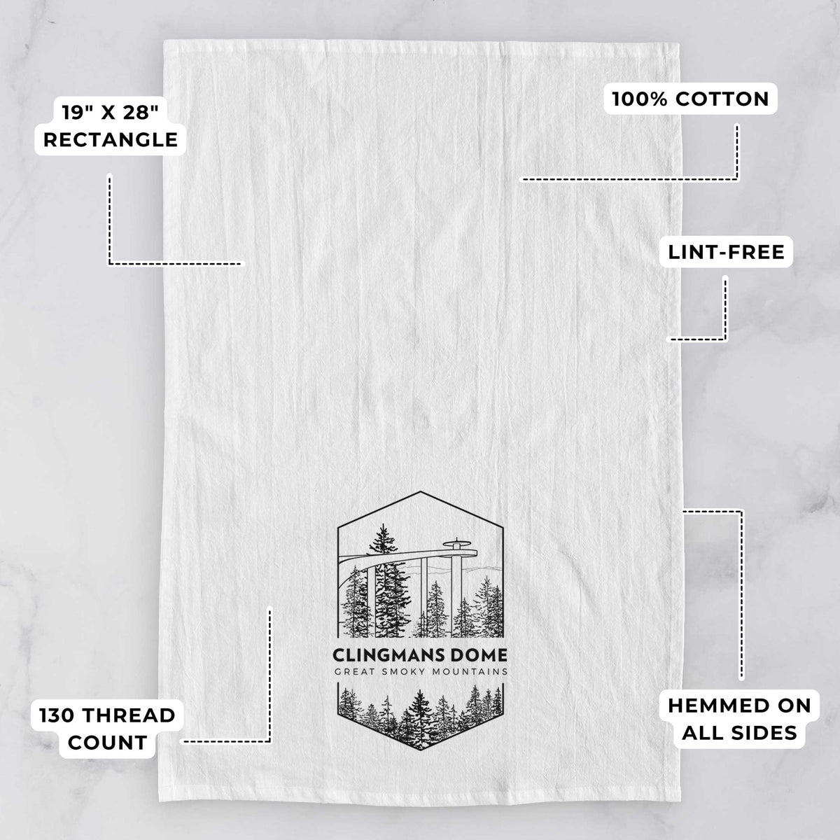 White tea towel printed with a black line art badge of the Clingmans Dome observation tower above a pine forest, with the words Clingmans Dome, Great Smoky Mountains, with feature labels: 19 by 28 inch rectangle, 100% cotton, lint-free, 130 thread count, hemmed on all sides.