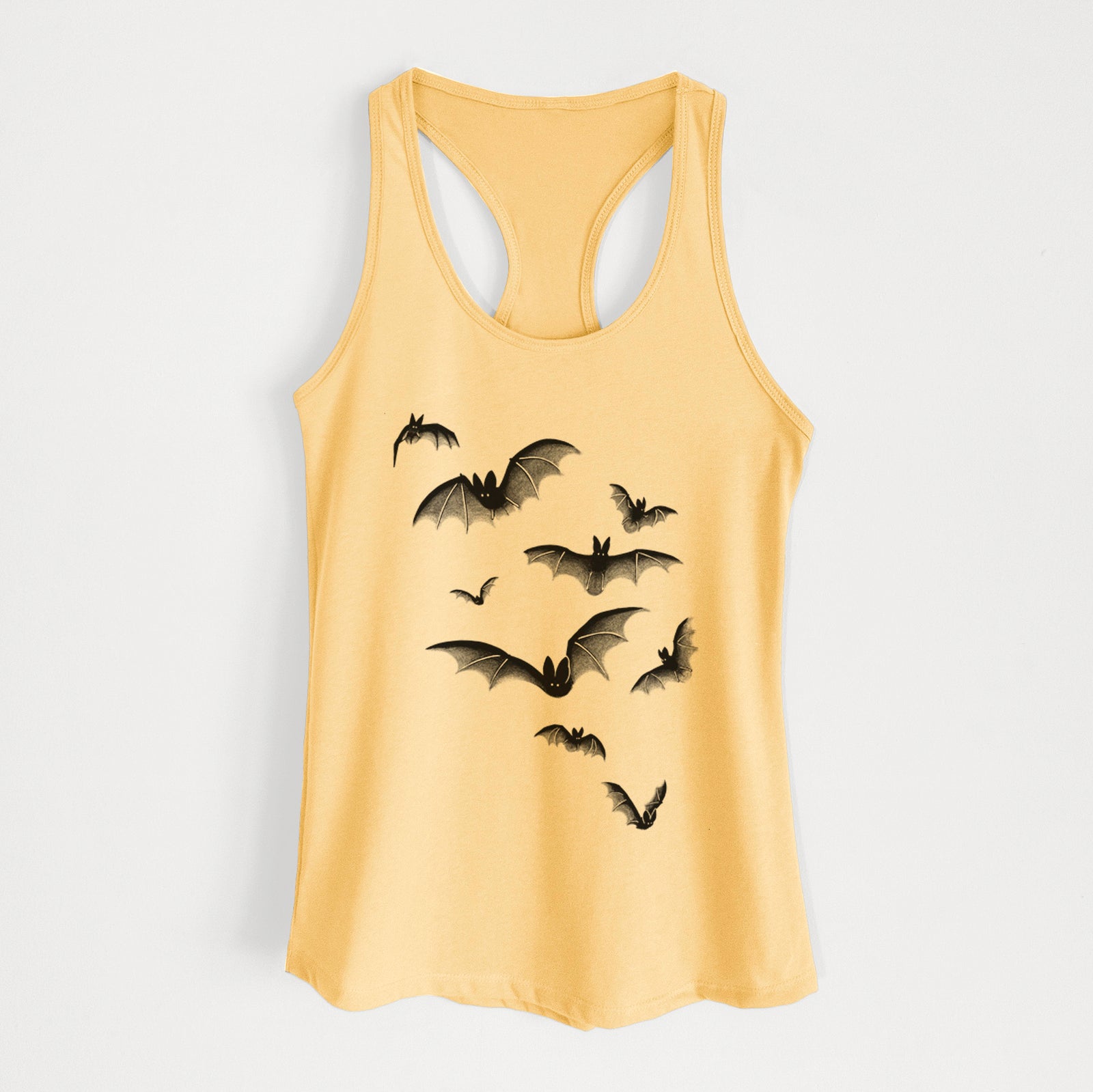 Banana cream women's racerback tank top laid flat, printed with a black ink illustration of a cloud of bats in flight.