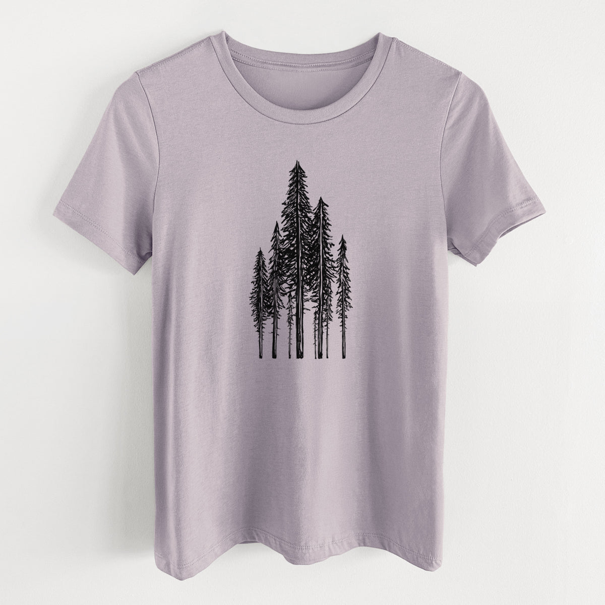 Light violet women's relaxed fit cotton t-shirt laid flat, printed with a black ink illustration of a stand of tall coastal redwood trees with slender trunks and layered branches.