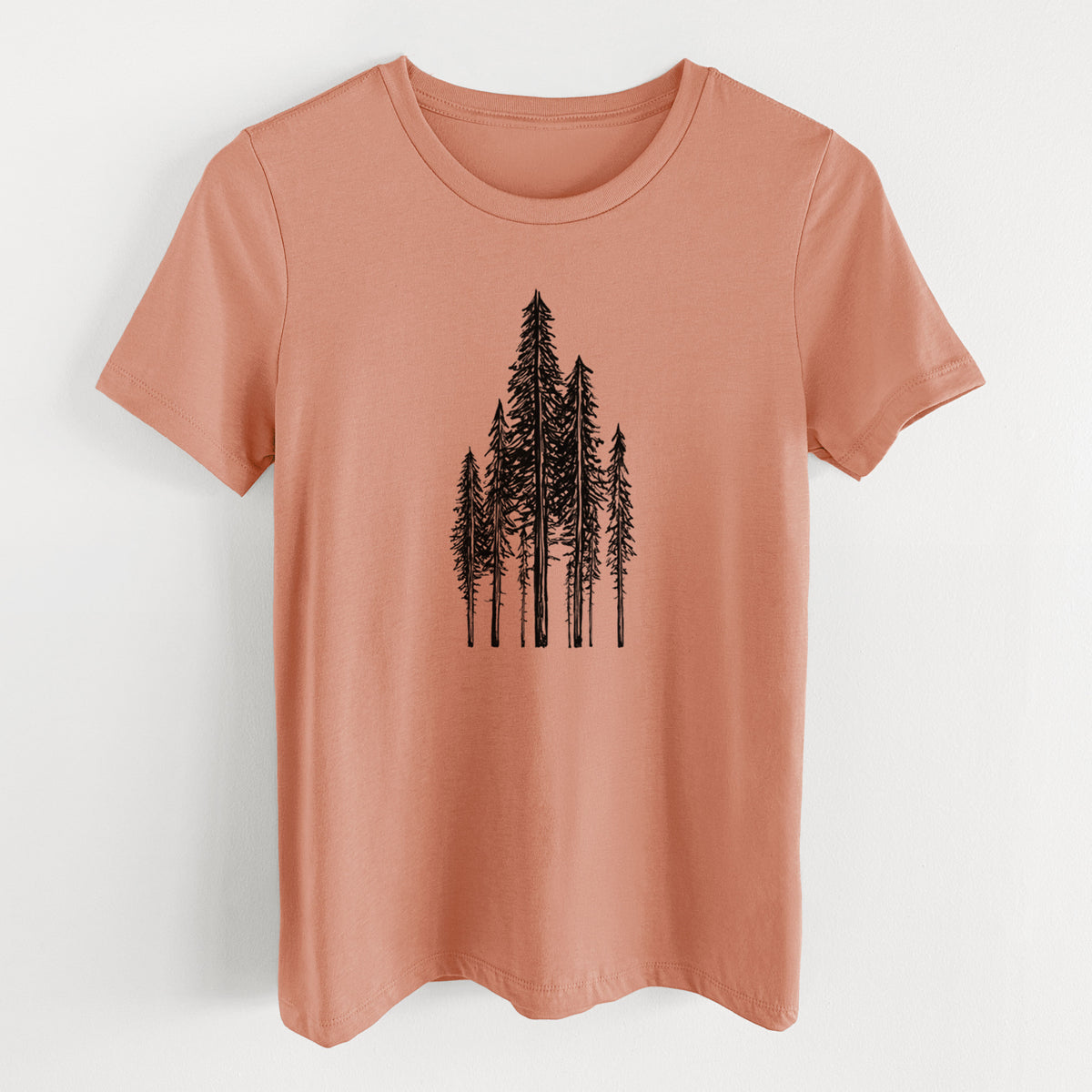 Terracotta orange women's relaxed fit cotton t-shirt laid flat, printed with a black ink illustration of a stand of tall coastal redwood trees with slender trunks and layered branches.