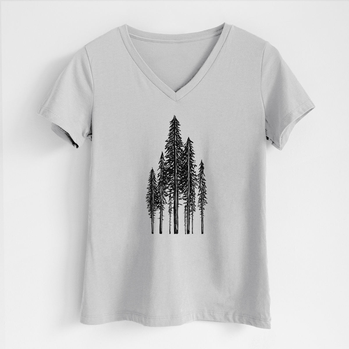 Lunar grey women's relaxed fit cotton V-neck t-shirt laid flat, printed with a black ink illustration of a stand of tall coastal redwood trees with slender trunks and layered branches.