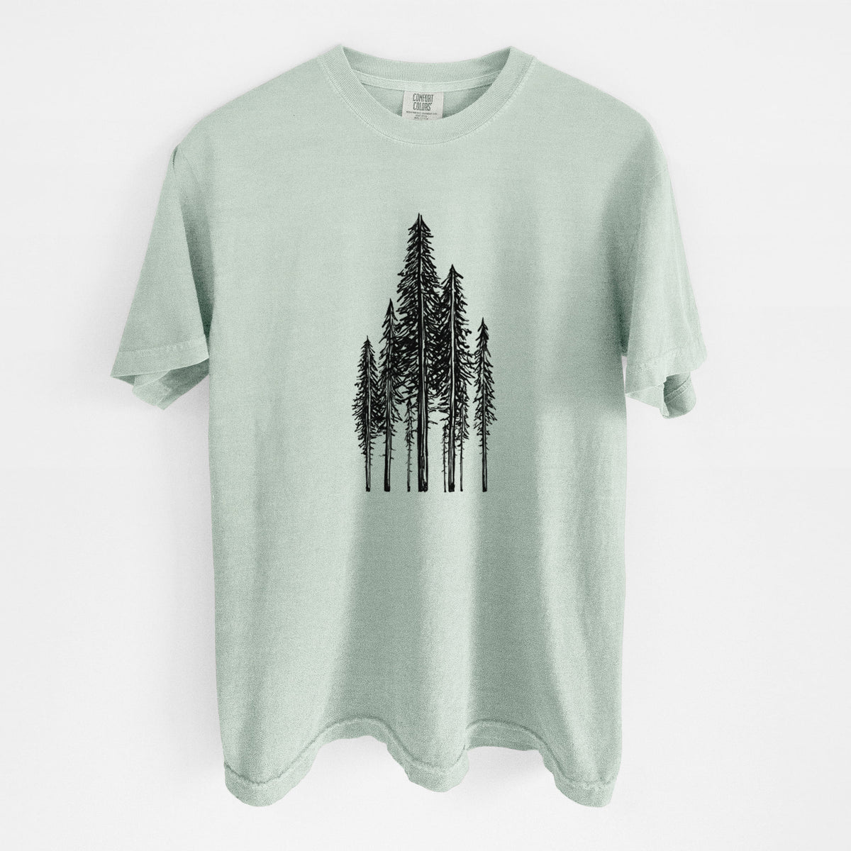 Bay green Comfort Colors t-shirt laid flat, printed with a black ink illustration of a stand of tall coastal redwood trees with slender trunks and layered branches.