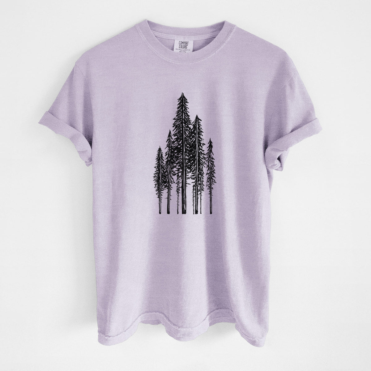Orchid purple Comfort Colors t-shirt laid flat, printed with a black ink illustration of a stand of tall coastal redwood trees with slender trunks and layered branches.