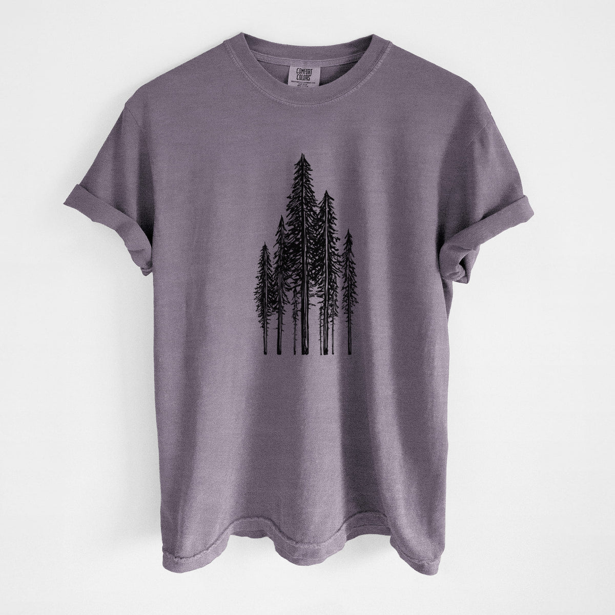Wine red Comfort Colors t-shirt laid flat, printed with a black ink illustration of a stand of tall coastal redwood trees with slender trunks and layered branches.