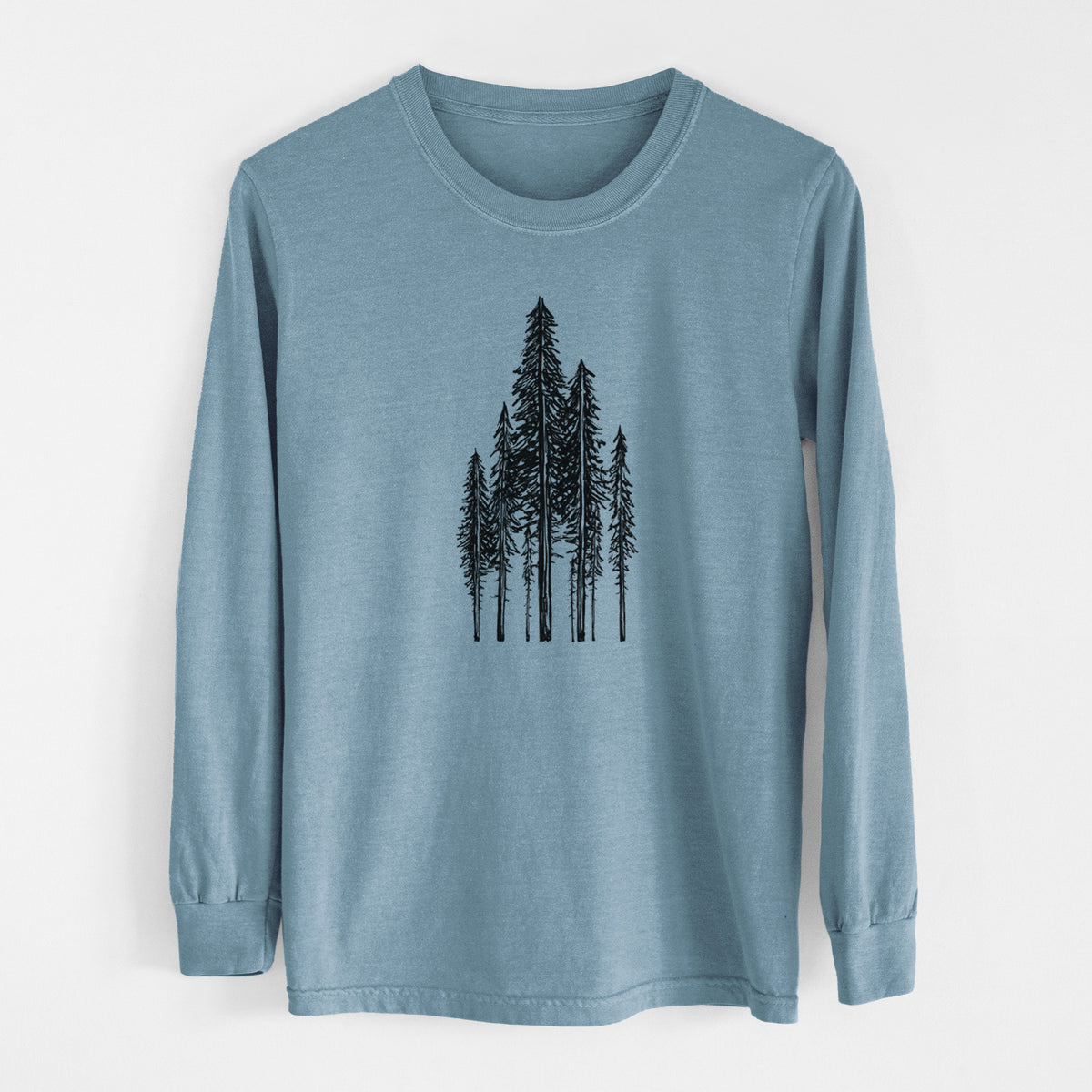 Steel blue Comfort Colors long sleeve shirt laid flat, printed with a black ink illustration of a stand of tall coastal redwood trees with slender trunks and layered branches.