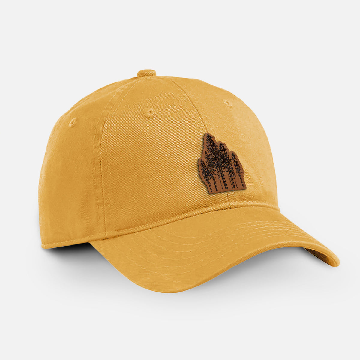 Beehive yellow cotton baseball hat with a black ink illustration of a stand of tall coastal redwood trees with slender trunks and layered branches on the front.