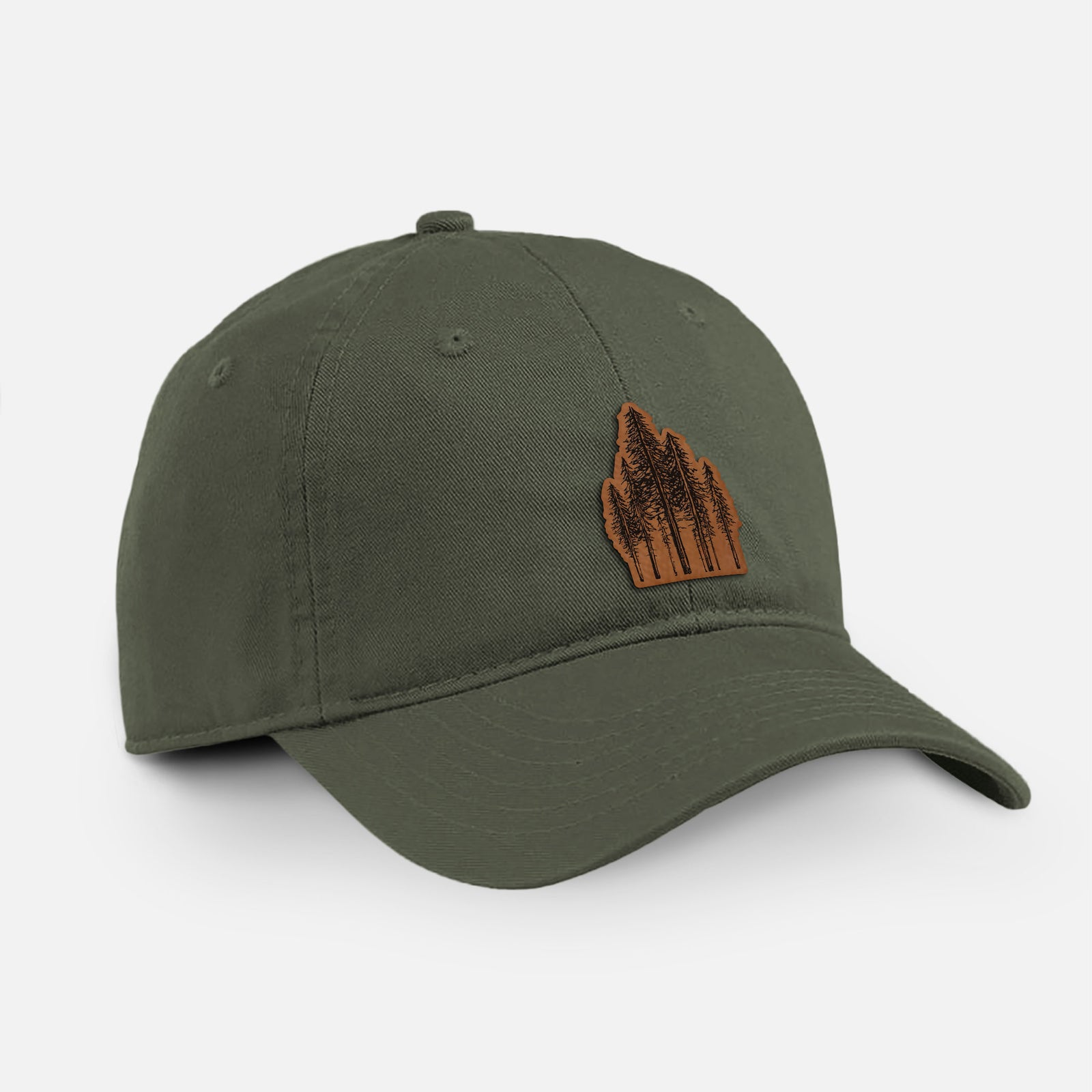 Olive cotton baseball hat with a black ink illustration of a stand of tall coastal redwood trees with slender trunks and layered branches on the front.