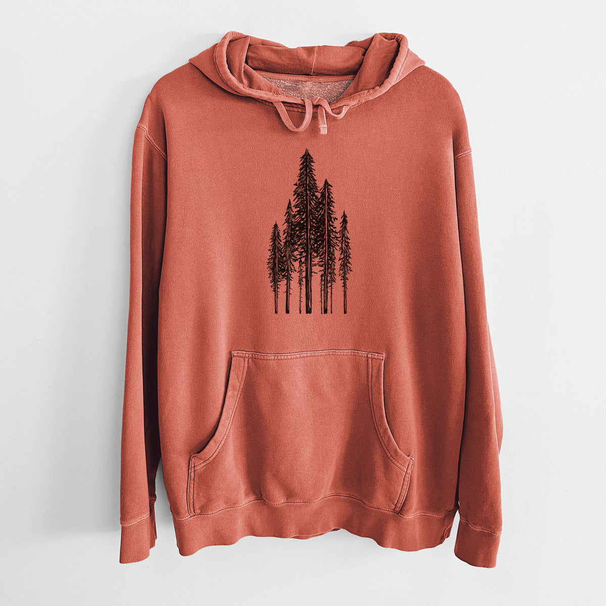 Amber orange pigment dyed hoodie laid flat, printed with a black ink illustration of a stand of tall coastal redwood trees with slender trunks and layered branches.