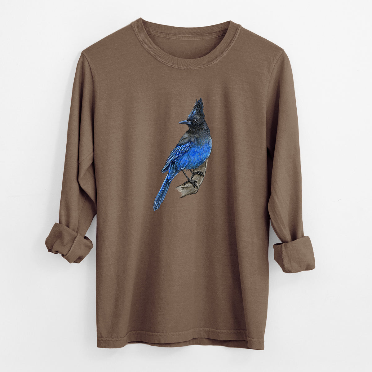 Espresso brown Comfort Colors long sleeve shirt laid flat with the cuffs rolled, printed with a full-color illustration of a Steller's jay perched with its dark crest raised.