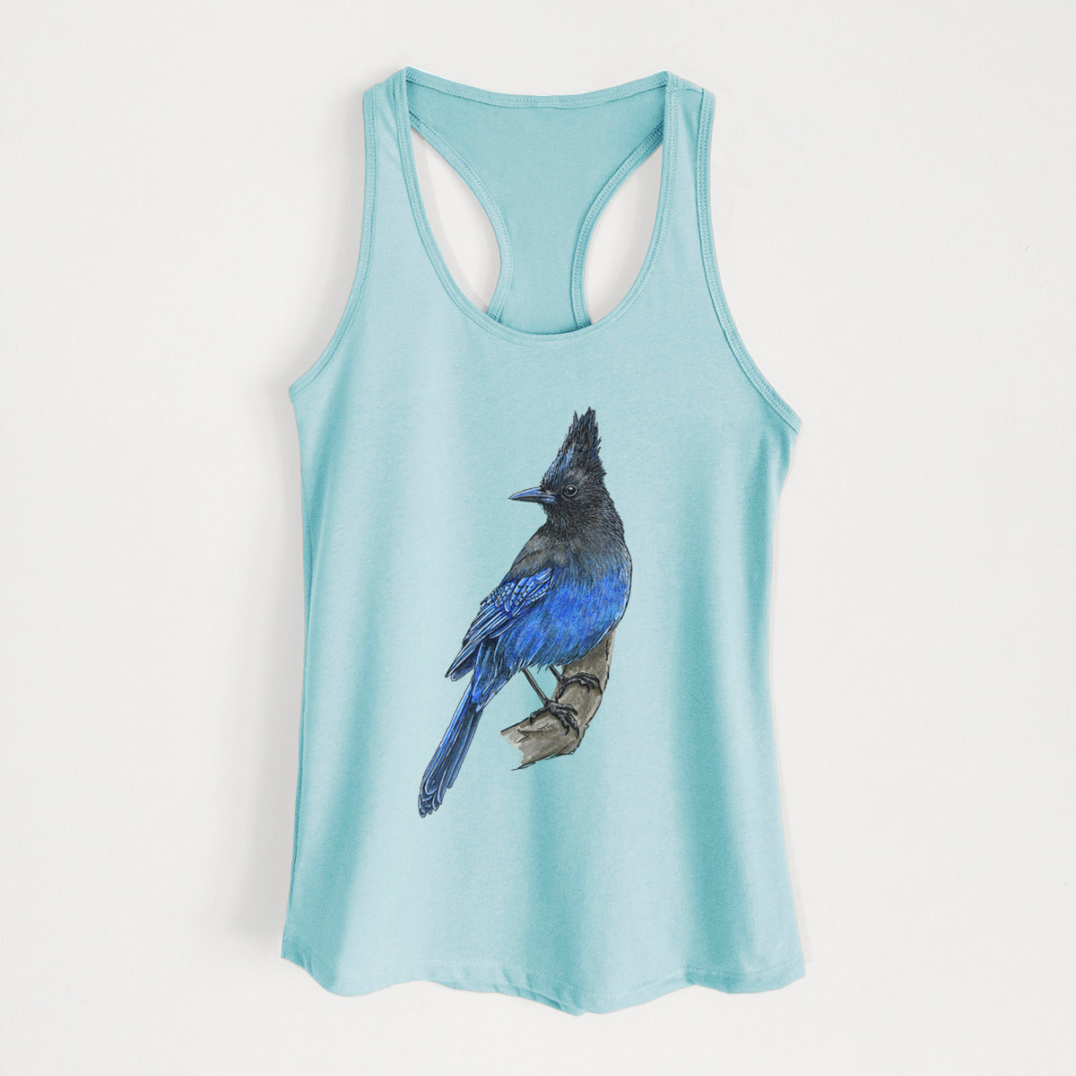 Cancun blue women's racerback tank top laid flat, printed with a full-color illustration of a Steller's jay perched with its dark crest raised.