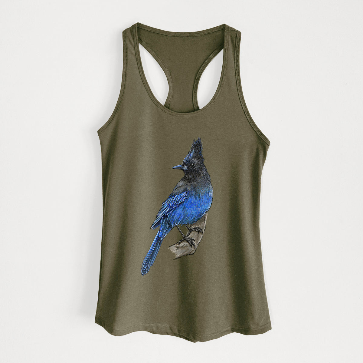 Military green women's racerback tank top laid flat, printed with a full-color illustration of a Steller's jay perched with its dark crest raised.