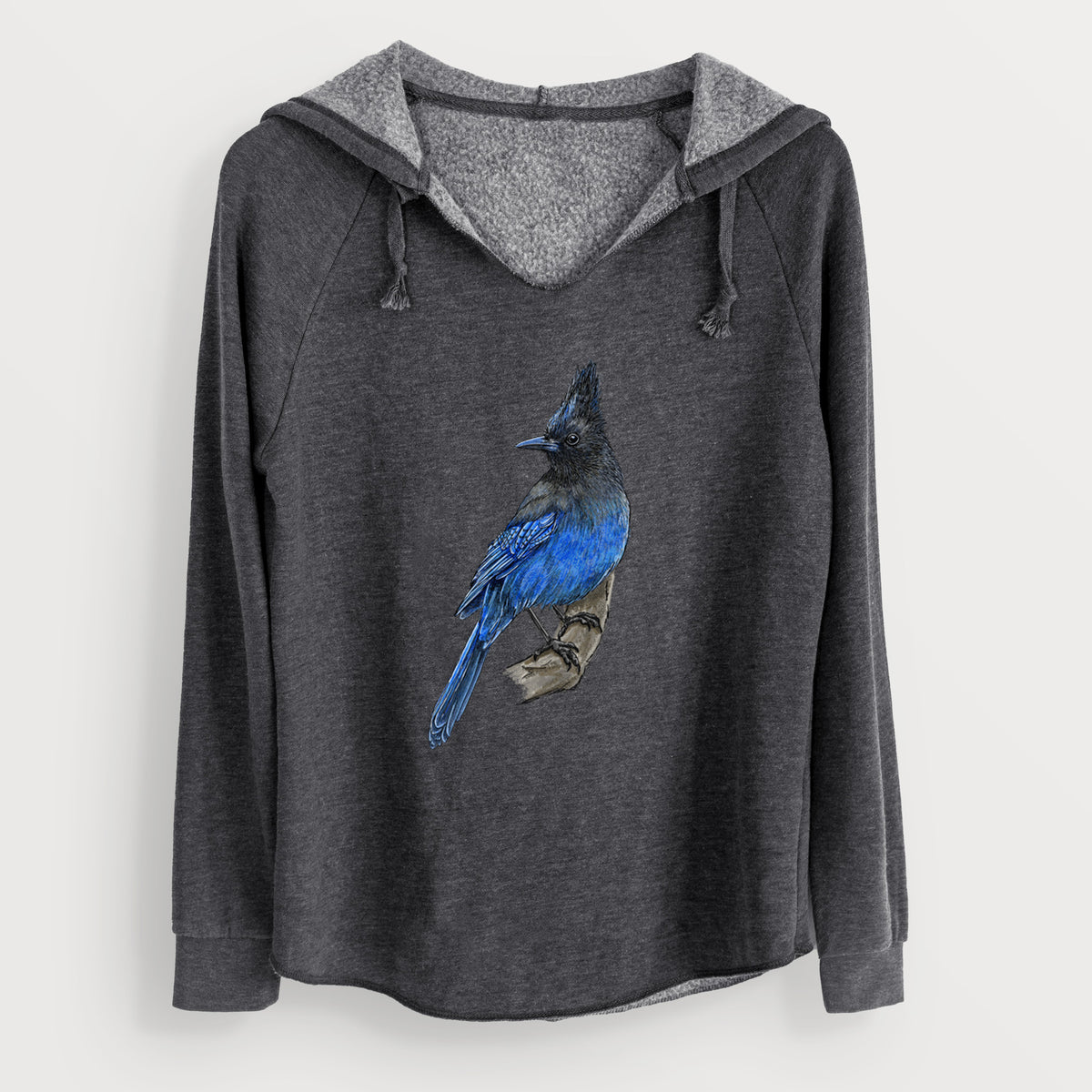 Charcoal grey women's Cali Wave hooded sweatshirt laid flat, printed with a full-color illustration of a Steller's jay perched with its dark crest raised.