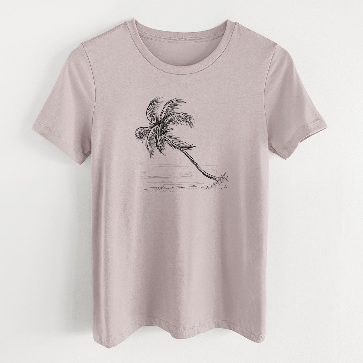 Pink gravel women's relaxed fit cotton t-shirt laid flat, printed with a black ink illustration of a coconut palm leaning over a sandy beach.