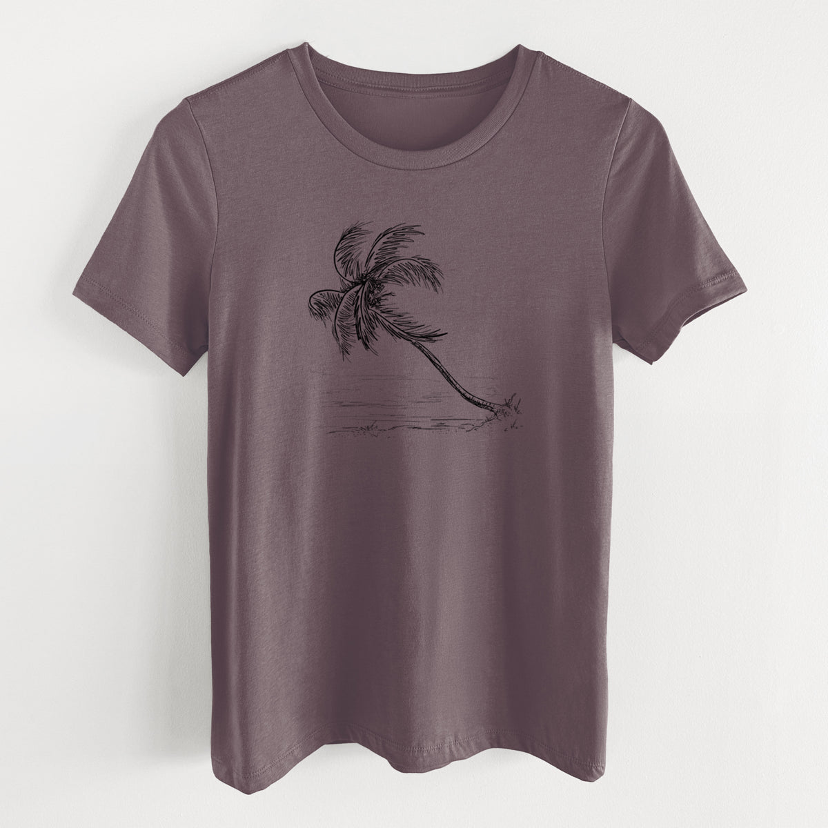 Purple storm women's relaxed fit cotton t-shirt laid flat, printed with a black ink illustration of a coconut palm leaning over a sandy beach.