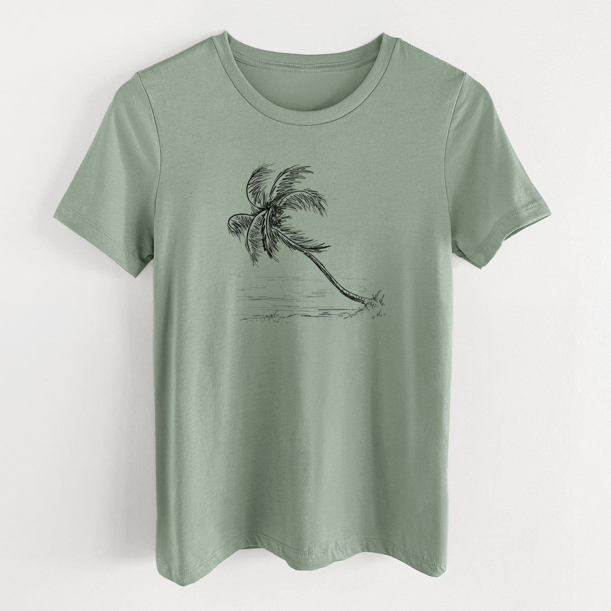 Sage green women's relaxed fit cotton t-shirt laid flat, printed with a black ink illustration of a coconut palm leaning over a sandy beach.