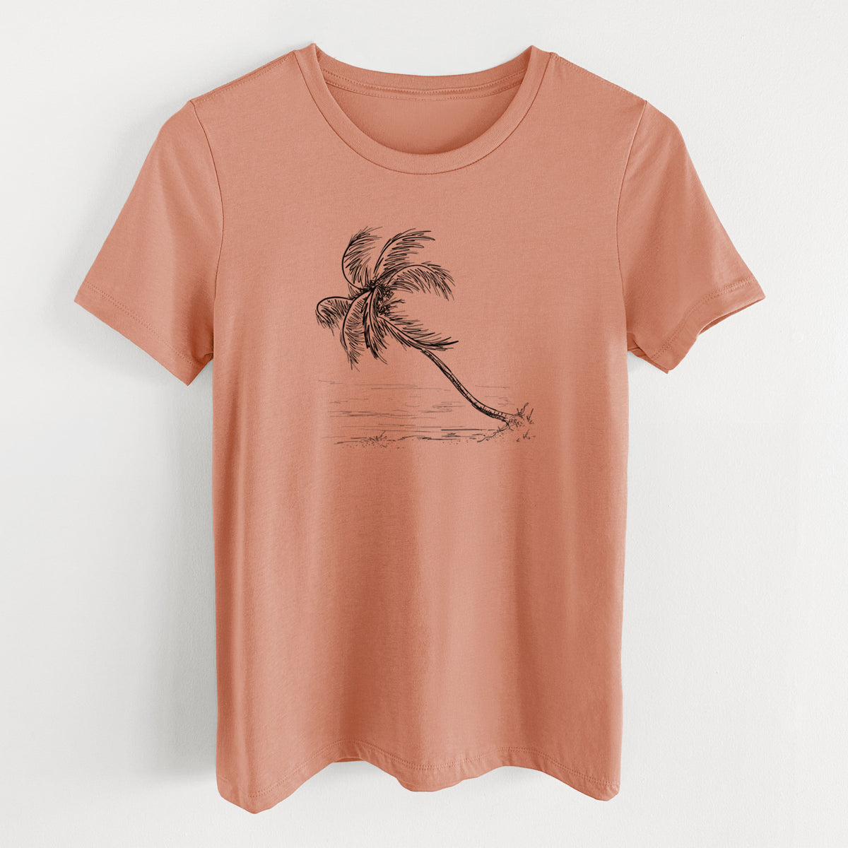 Terracotta orange women's relaxed fit cotton t-shirt laid flat, printed with a black ink illustration of a coconut palm leaning over a sandy beach.