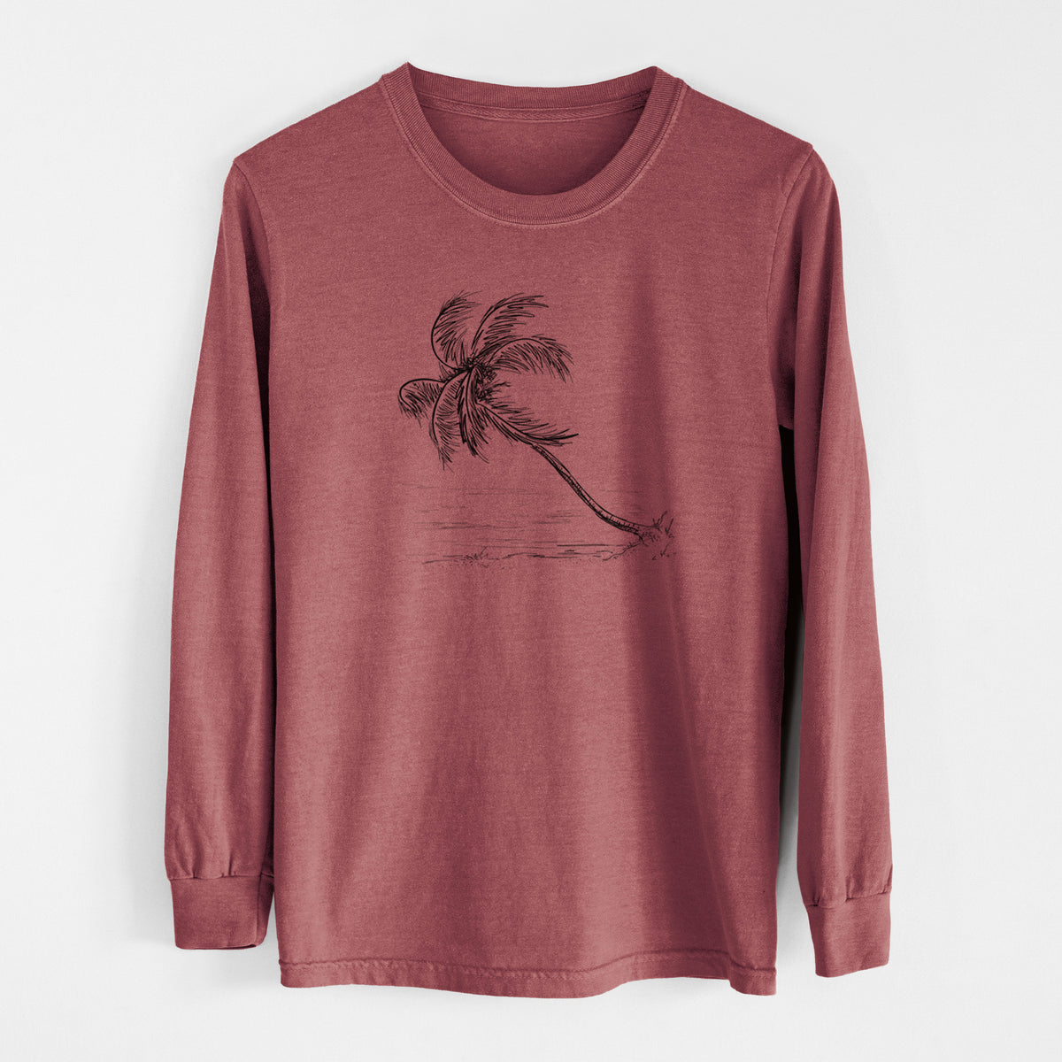 Brick red Comfort Colors long sleeve shirt laid flat, printed with a black ink illustration of a coconut palm leaning over a sandy beach.