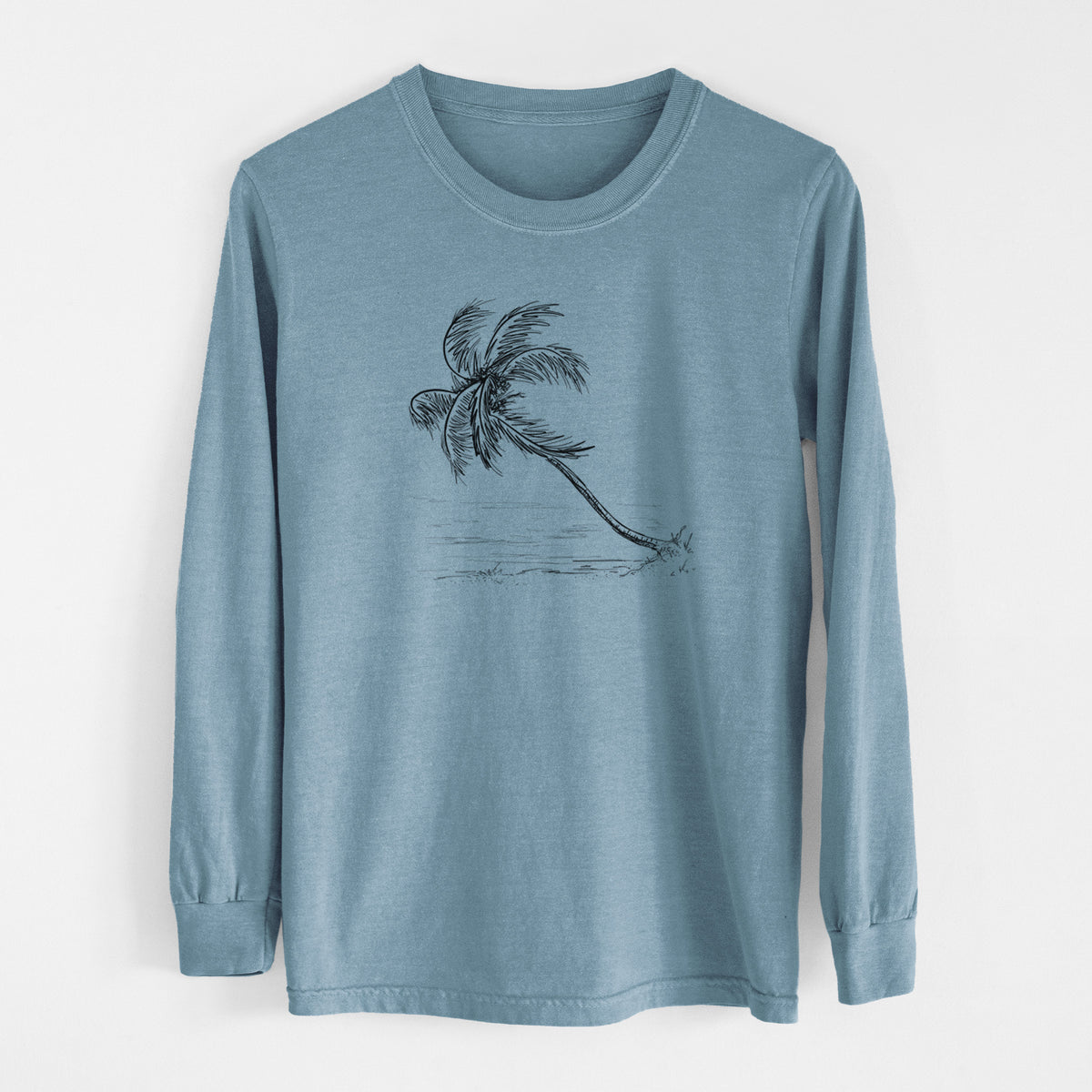 Steel blue Comfort Colors long sleeve shirt laid flat, printed with a black ink illustration of a coconut palm leaning over a sandy beach.
