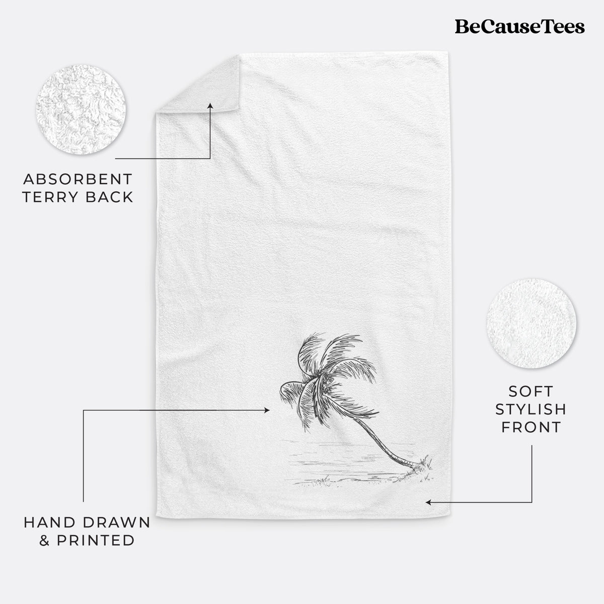 White hand towel printed with a black ink illustration of a coconut palm leaning over a sandy beach.