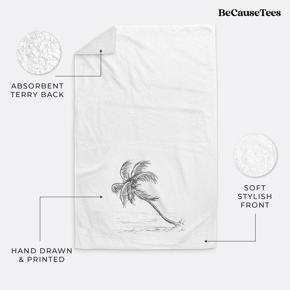 White hand towel printed with a black ink illustration of a coconut palm leaning over a sandy beach.