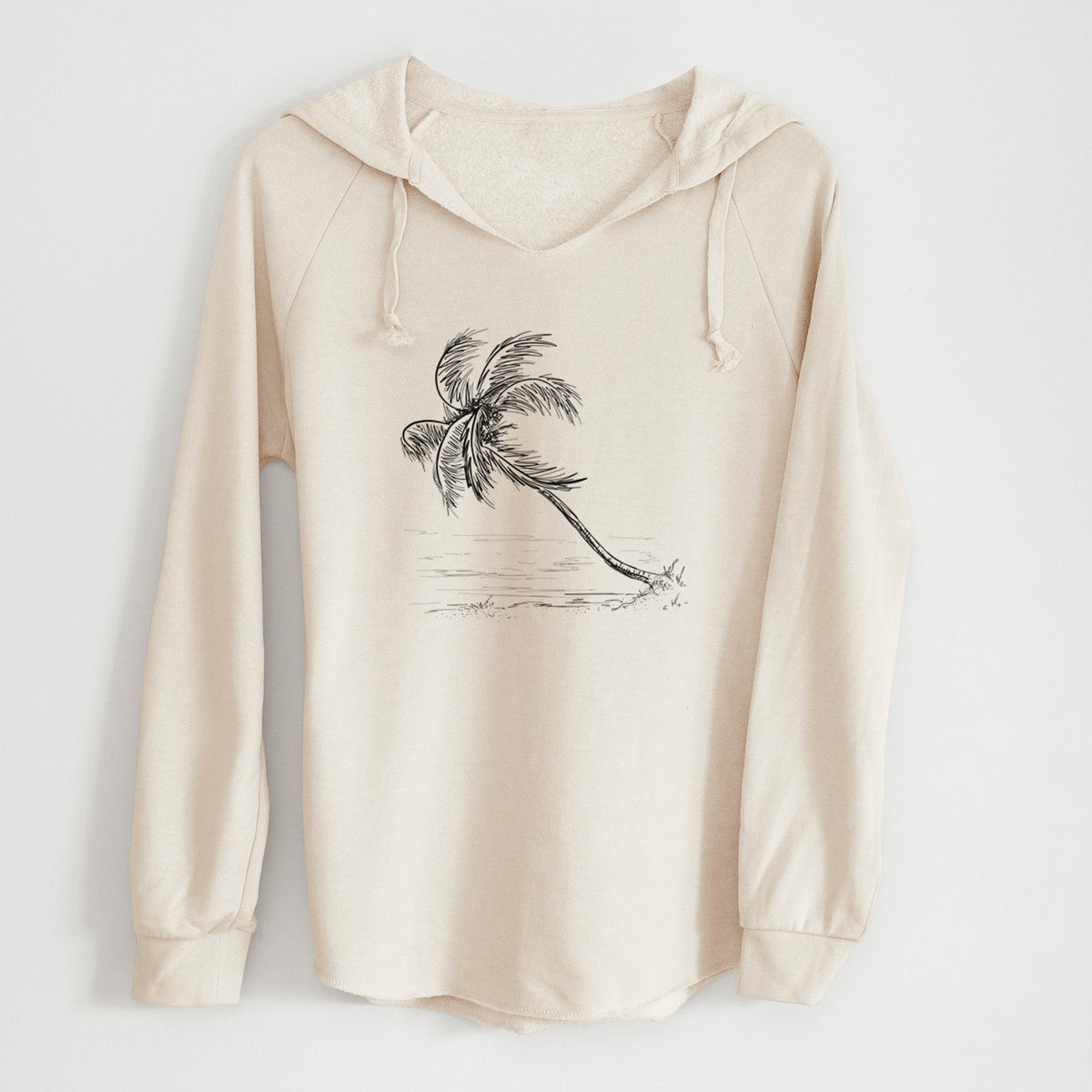 Bone cream women's Cali Wave hooded sweatshirt laid flat, printed with a black ink illustration of a coconut palm leaning over a sandy beach.