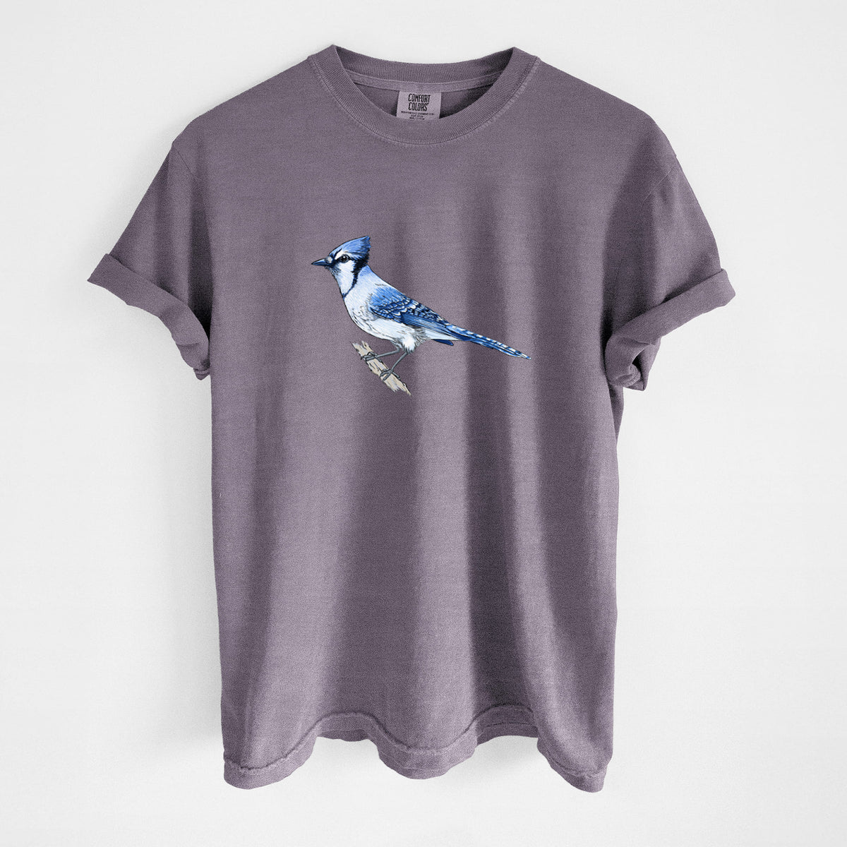 Wine red Comfort Colors t-shirt laid flat, printed with a full-color illustration of a blue jay perched on a branch.