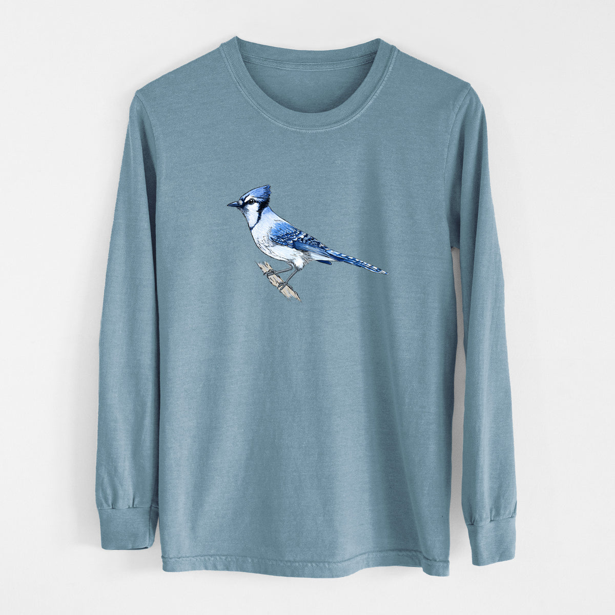 Steel blue Comfort Colors long sleeve shirt laid flat, printed with a full-color illustration of a blue jay perched on a branch.