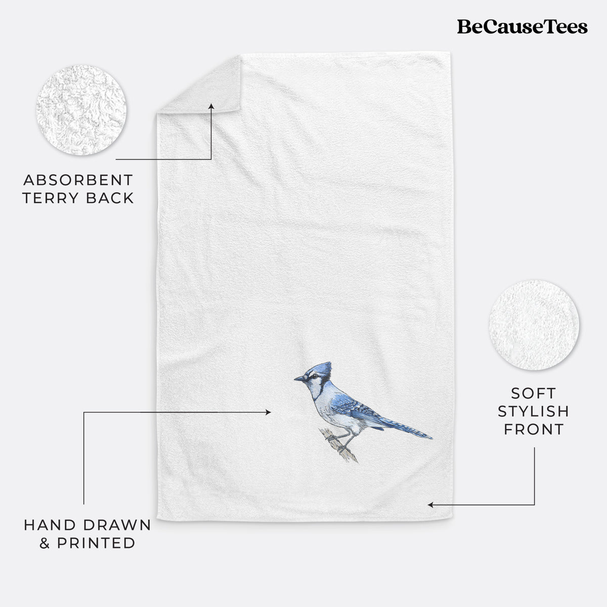 White hand towel printed with a full-color illustration of a blue jay perched on a branch.
