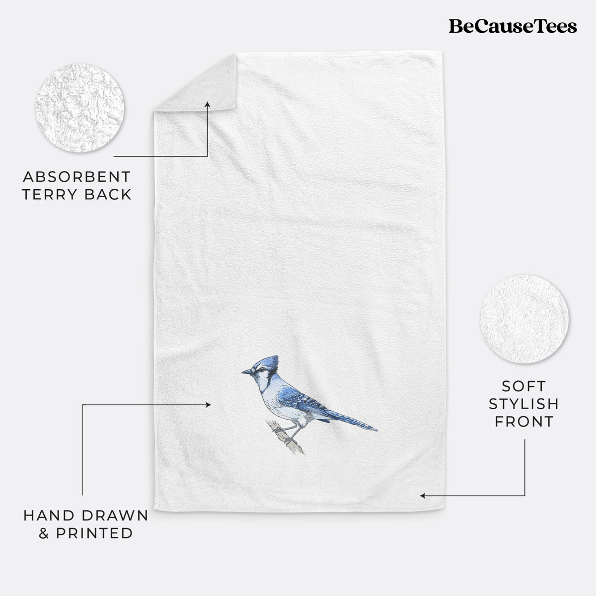 White hand towel printed with a full-color illustration of a blue jay perched on a branch.