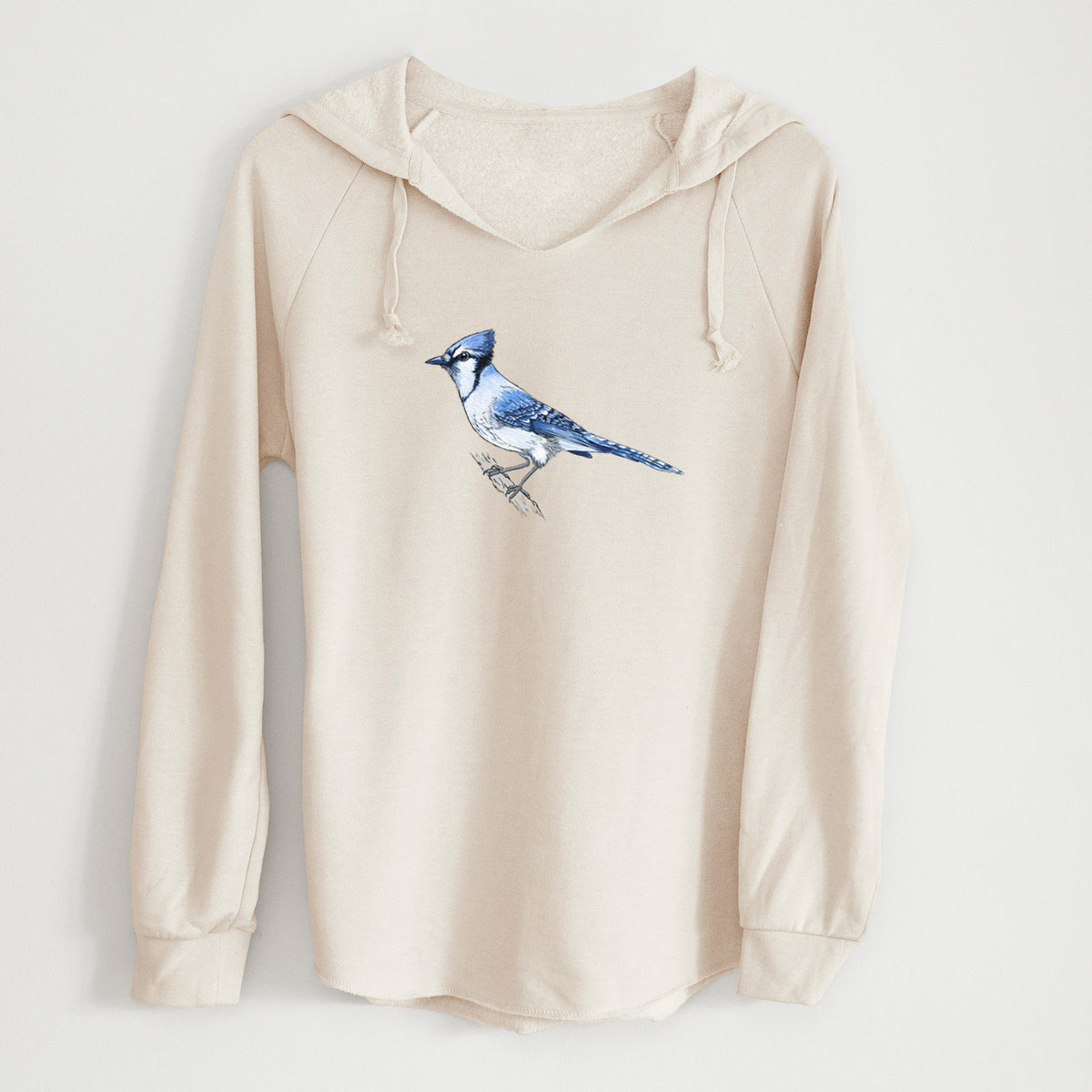 Bone cream women's Cali Wave hooded sweatshirt laid flat, printed with a full-color illustration of a blue jay perched on a branch.
