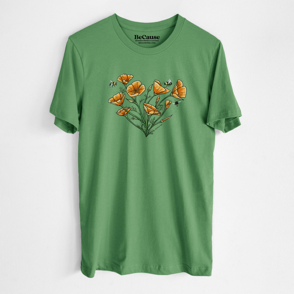 Leaf green lightweight cotton t-shirt laid flat, printed with a full-color bouquet of orange California poppies arranged in a heart shape, with small bees.
