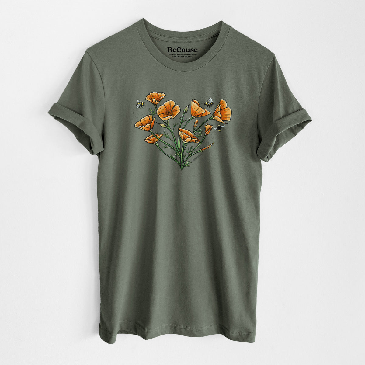 Military green lightweight cotton t-shirt laid flat, printed with a full-color bouquet of orange California poppies arranged in a heart shape, with small bees.
