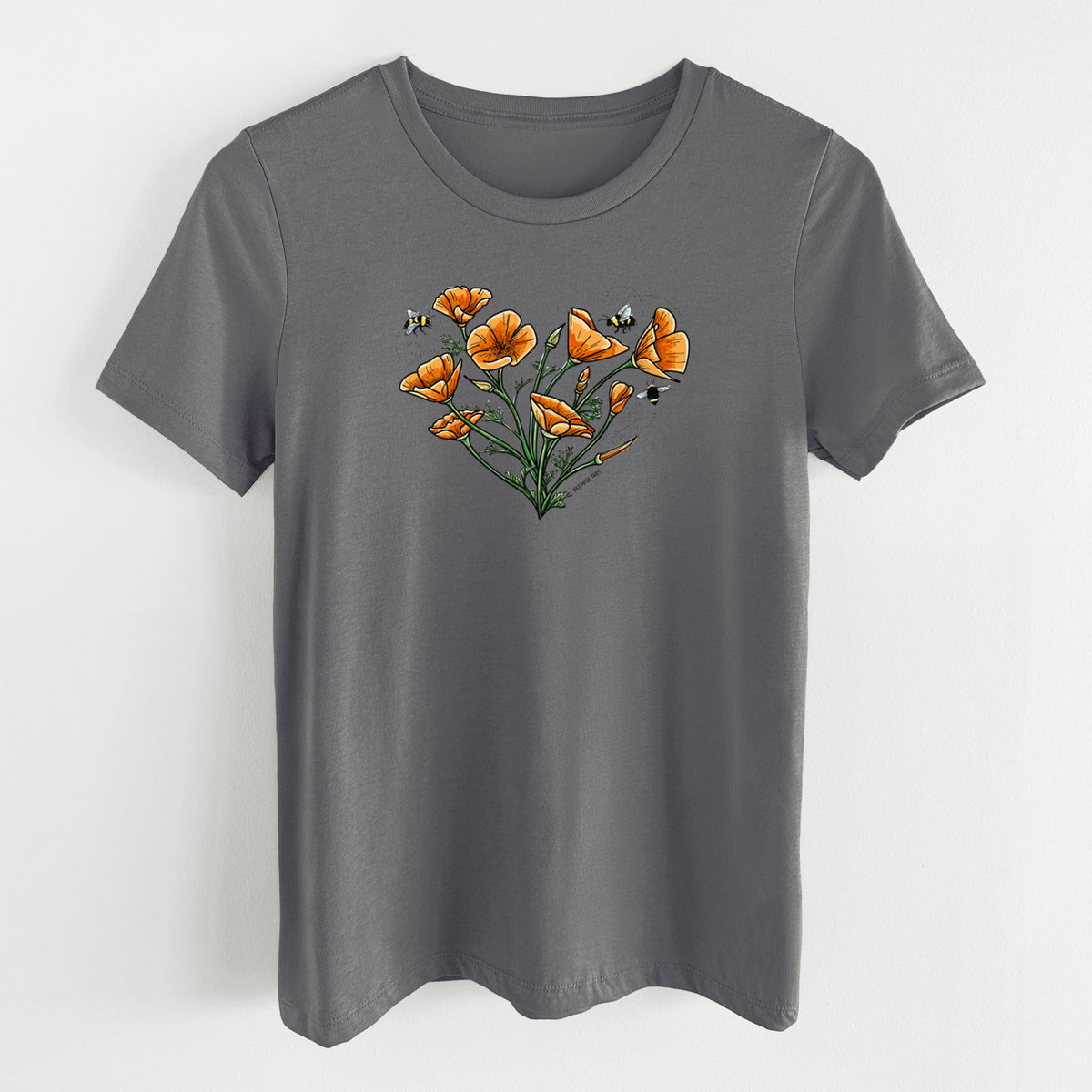 Asphalt women's relaxed fit cotton t-shirt laid flat, printed with a full-color bouquet of orange California poppies arranged in a heart shape, with small bees.