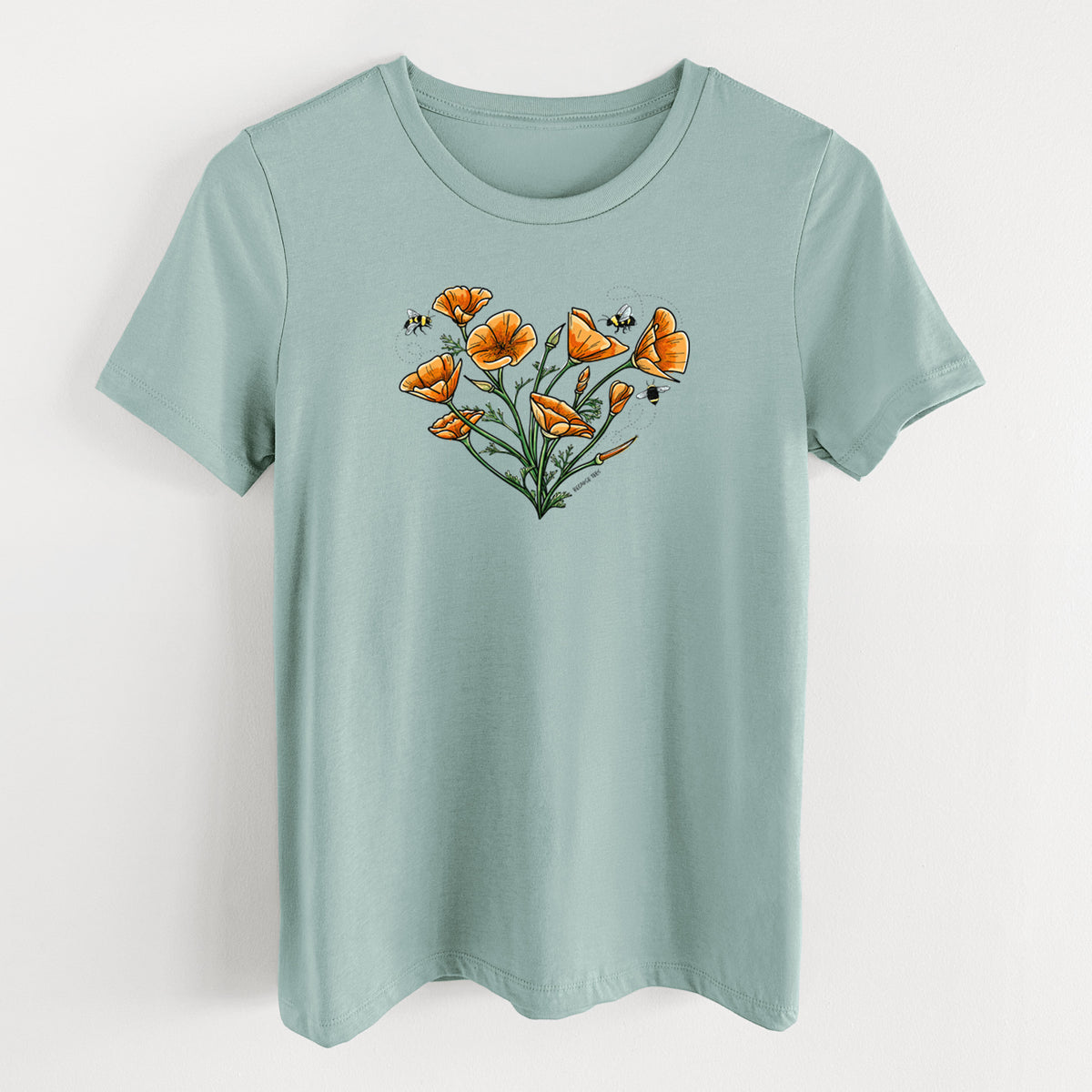 Dusty blue women's relaxed fit cotton t-shirt laid flat, printed with a full-color bouquet of orange California poppies arranged in a heart shape, with small bees.