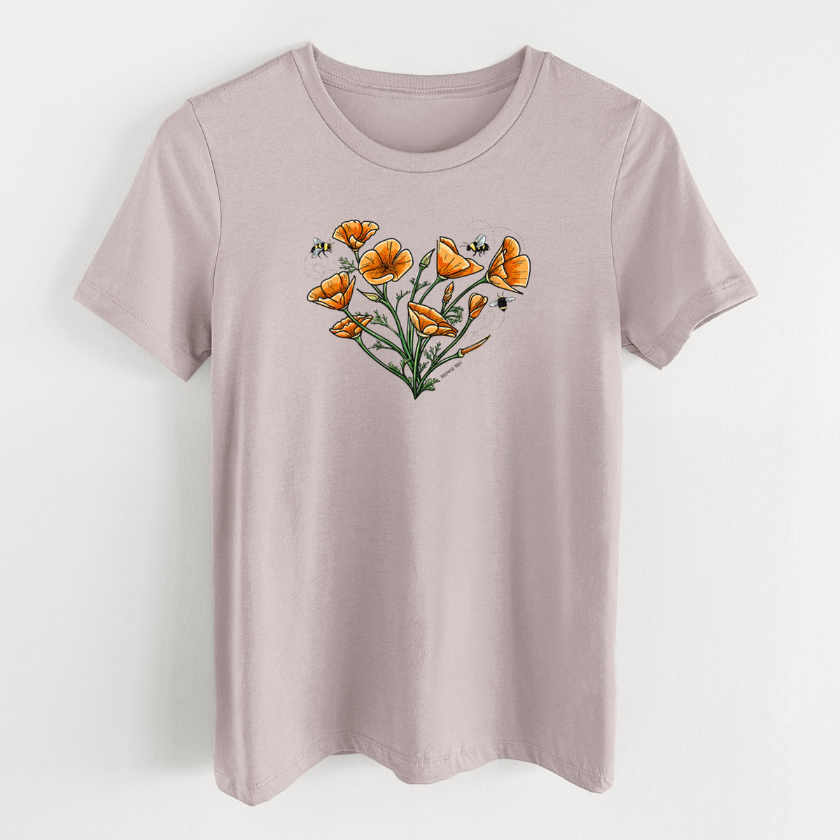 Pink gravel women's relaxed fit cotton t-shirt laid flat, printed with a full-color bouquet of orange California poppies arranged in a heart shape, with small bees.