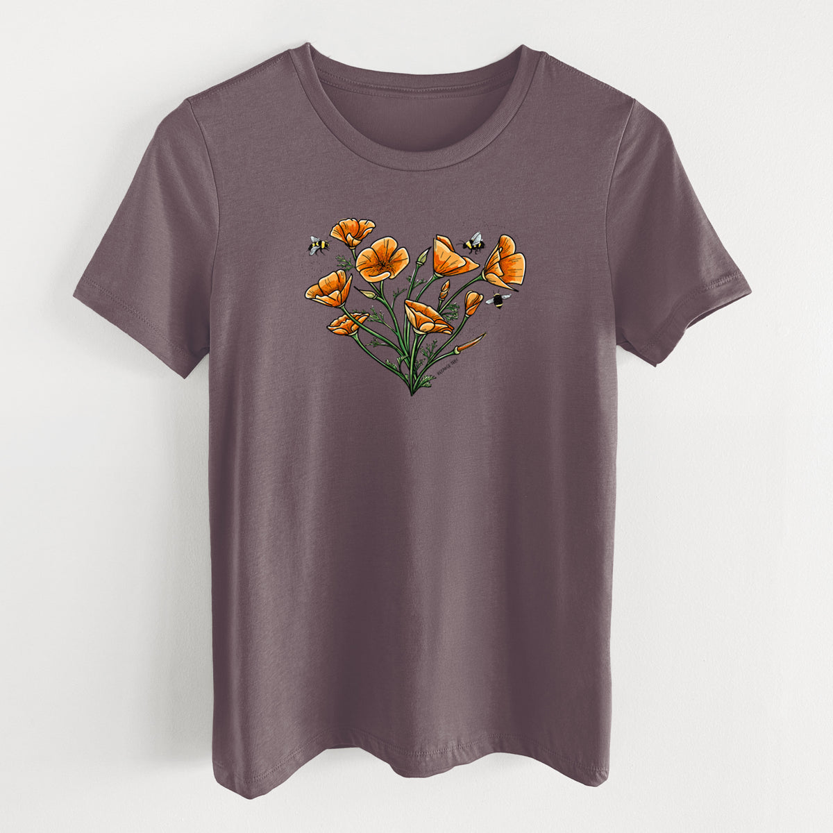 Purple storm women's relaxed fit cotton t-shirt laid flat, printed with a full-color bouquet of orange California poppies arranged in a heart shape, with small bees.