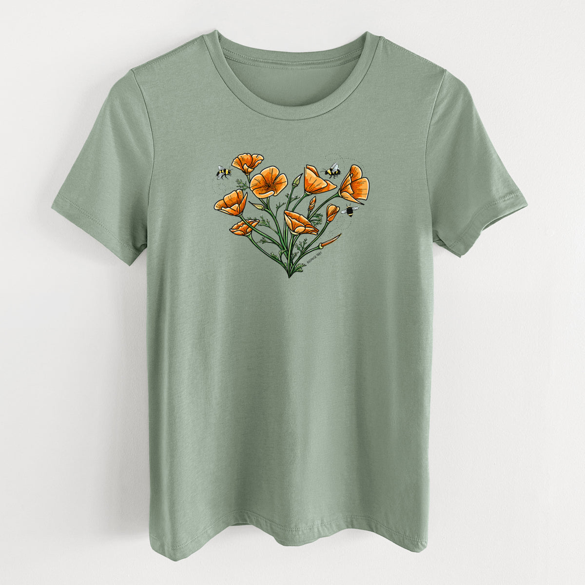 Sage green women's relaxed fit cotton t-shirt laid flat, printed with a full-color bouquet of orange California poppies arranged in a heart shape, with small bees.