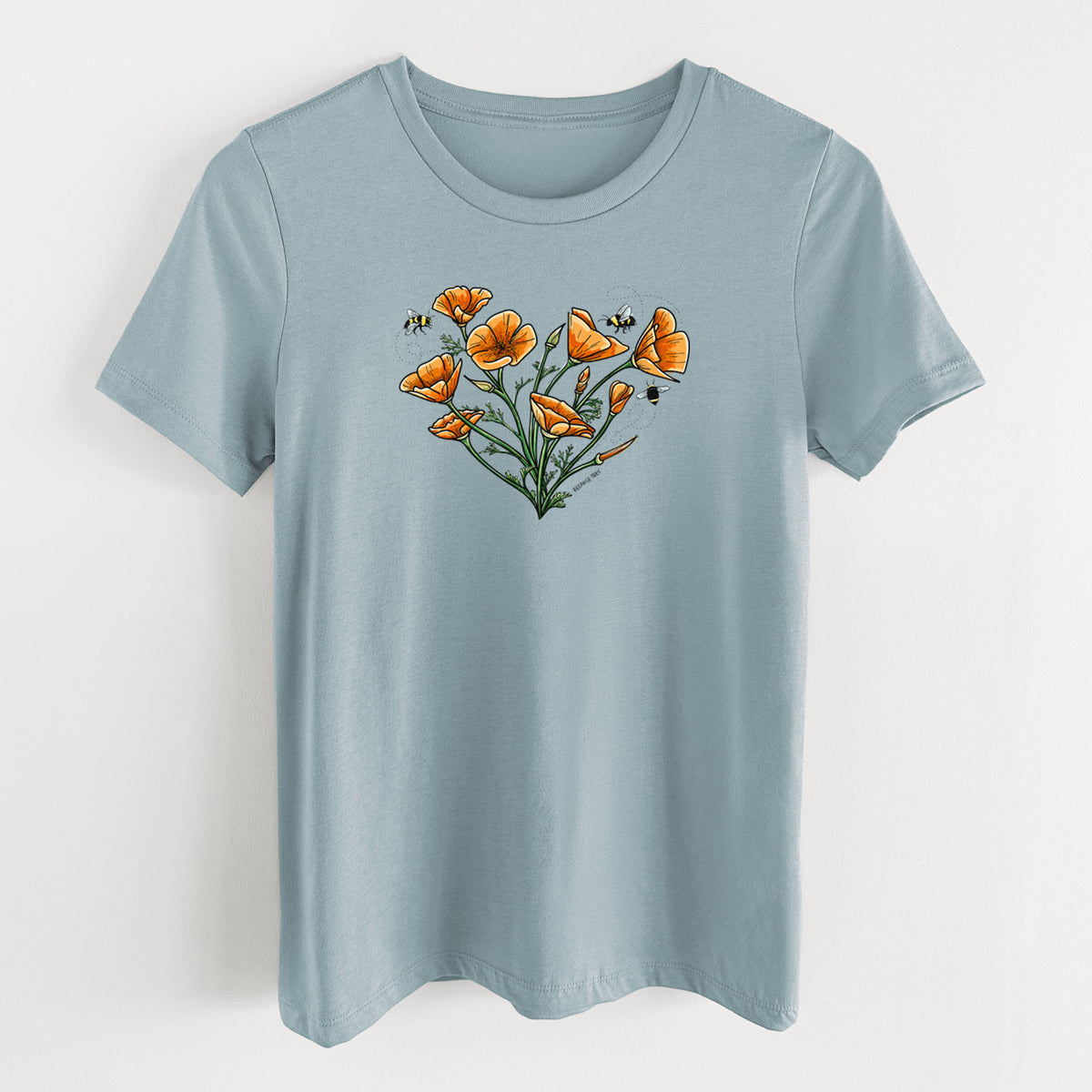 Vintage denim women's relaxed fit cotton t-shirt laid flat, printed with a full-color bouquet of orange California poppies arranged in a heart shape, with small bees.