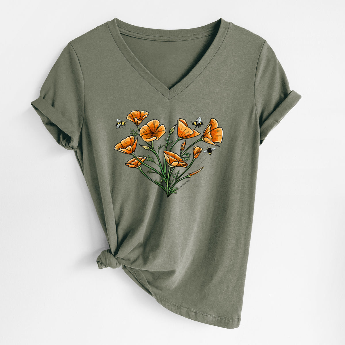 Military green women's relaxed fit cotton V-neck t-shirt laid flat, printed with a full-color bouquet of orange California poppies arranged in a heart shape, with small bees.