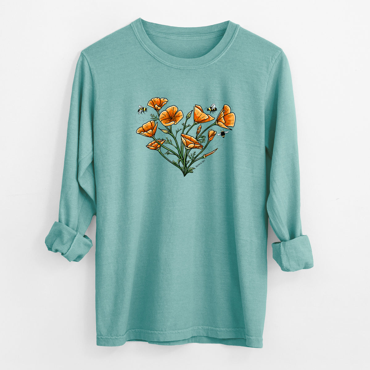 Reef green Comfort Colors long sleeve shirt laid flat with the cuffs rolled, printed with a full-color bouquet of orange California poppies arranged in a heart shape, with small bees.