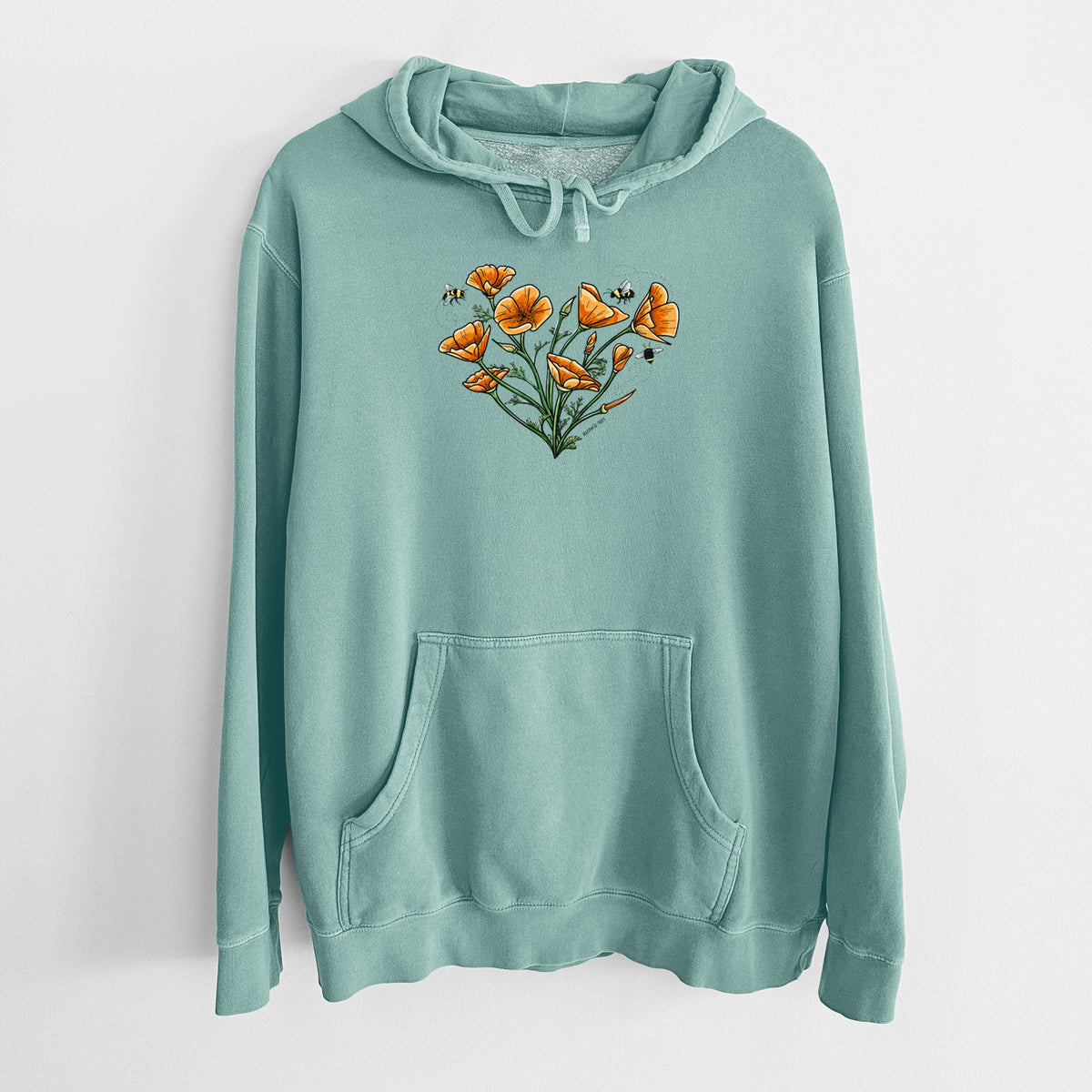 Mint green pigment dyed hoodie laid flat, printed with a full-color bouquet of orange California poppies arranged in a heart shape, with small bees.