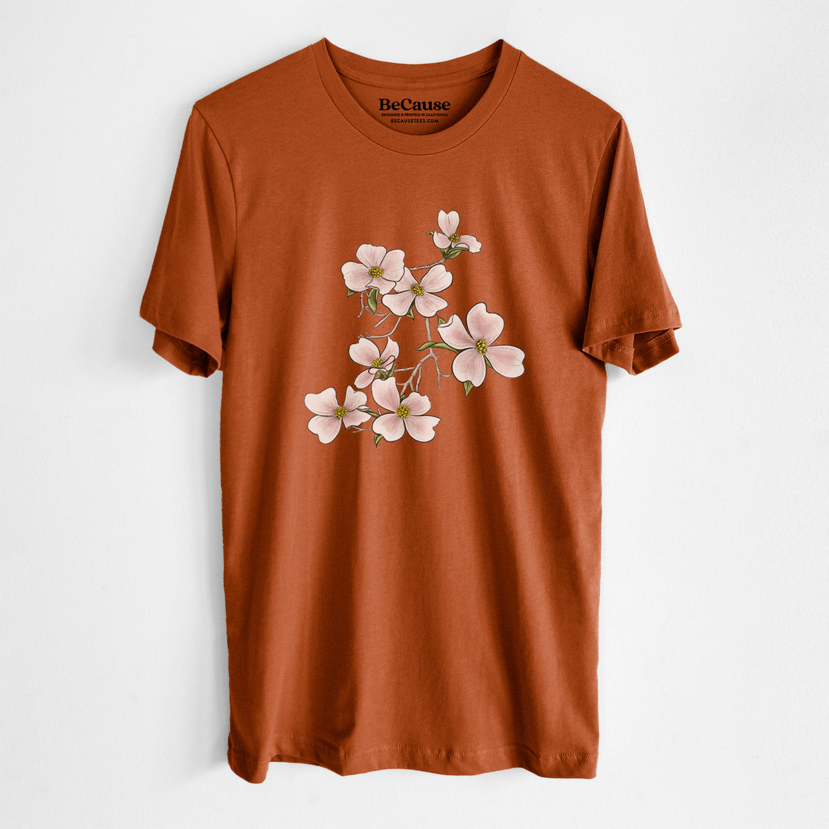 Autumn lightweight cotton t-shirt laid flat, printed with a full-color illustration of pink and white dogwood blossoms on a branch.