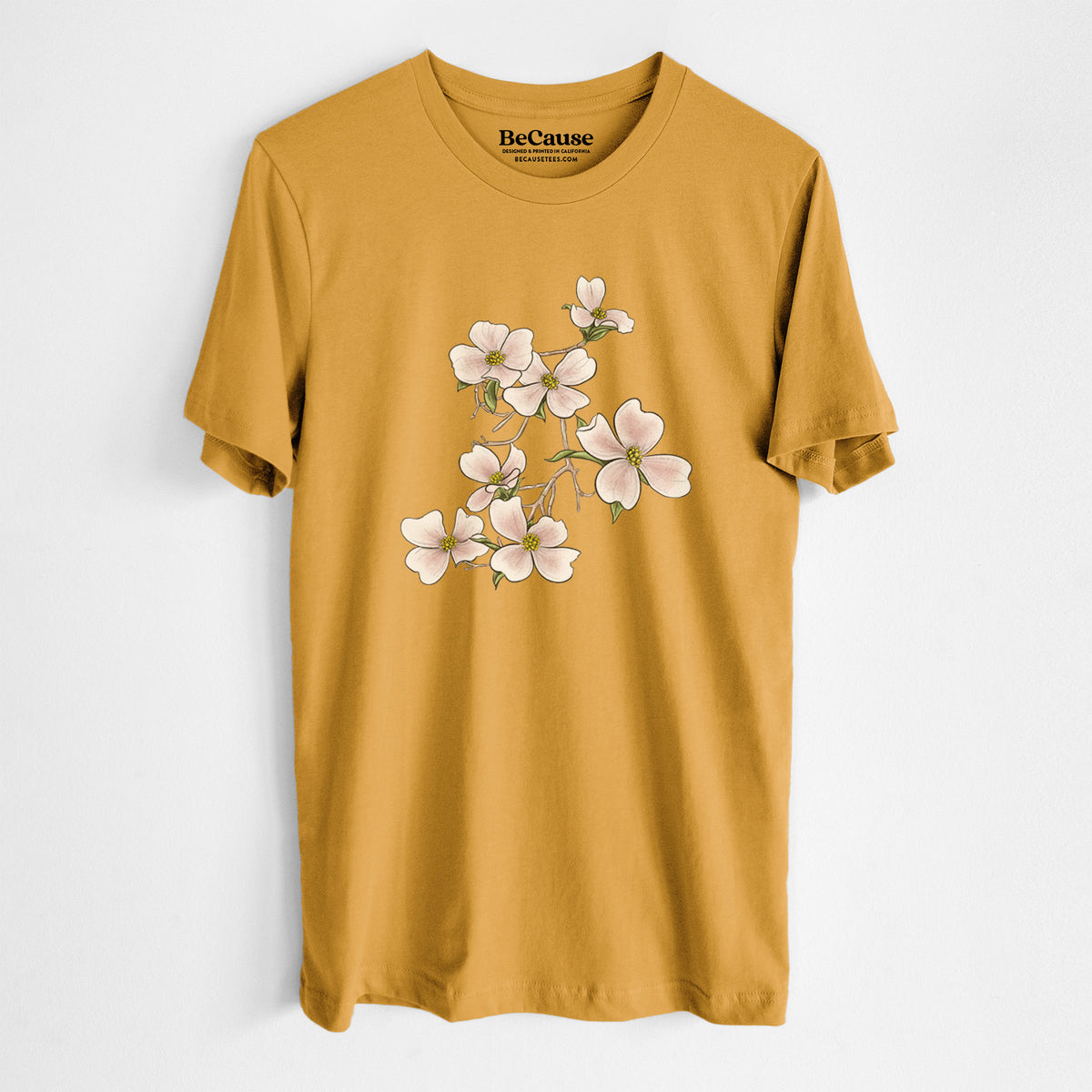 Mustard yellow lightweight cotton t-shirt laid flat, printed with a full-color illustration of pink and white dogwood blossoms on a branch.
