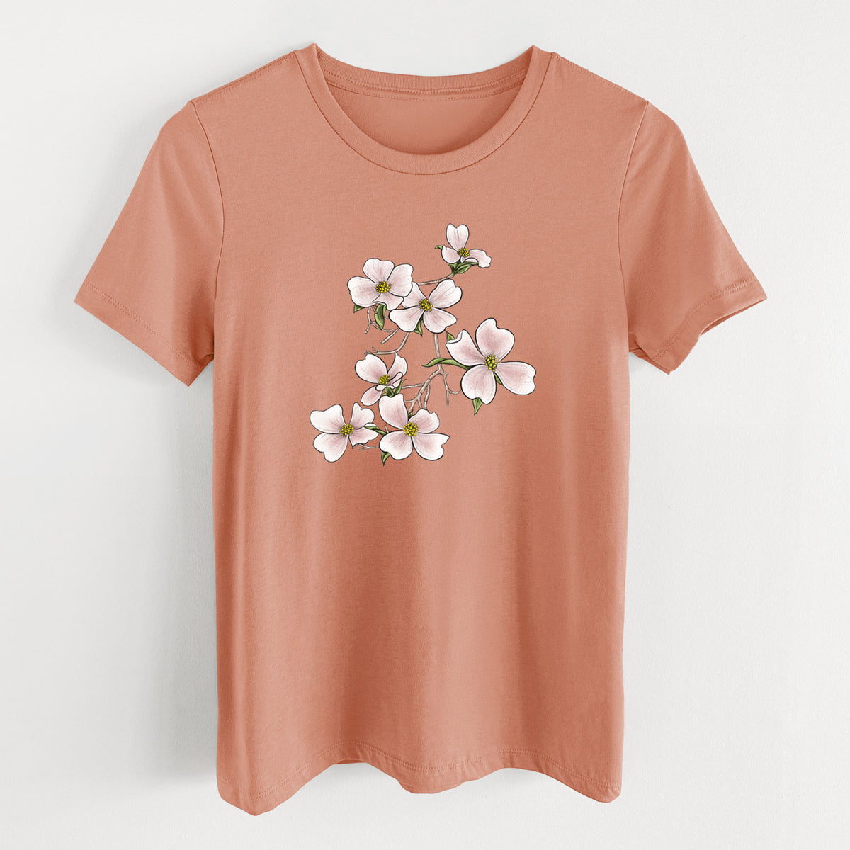 Terracotta orange women's relaxed fit cotton t-shirt laid flat, printed with a full-color illustration of pink and white dogwood blossoms on a branch.